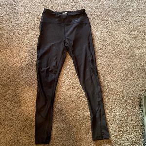 Avia black leggings w star embellishments and mesh at ankles to knee on side